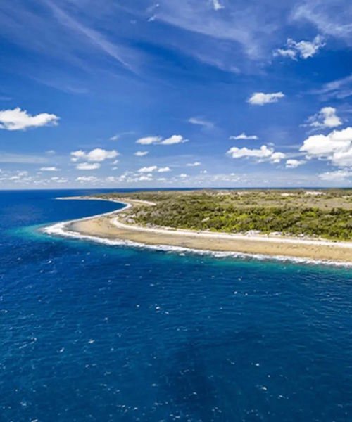 Aerial view of Nauru coastline with blue ocean